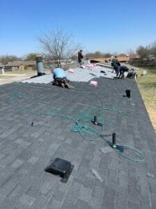 Employees fixing shingle Roof in Killeen TX